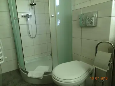 a bathroom with a toilet and a shower at ZłotyOgród in Wieliczka