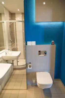 a bathroom with a toilet and a sink at Modern Apartment in City Center in Kraków