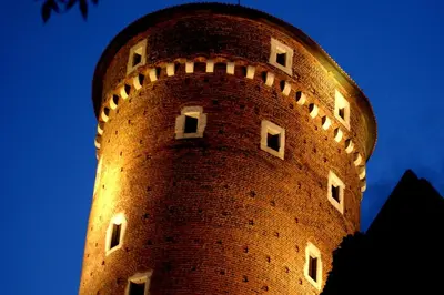 a brick tower with windows on the top of it at AR Apartments - Angel Center Kraków in Kraków