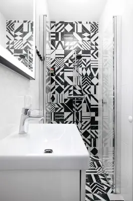a white bathroom with a sink and a shower at Rakowicka 71 Partnerapart in Kraków