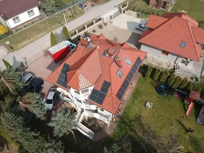 an overhead view of a house with solar panels on its roof at Apartamenty Nad Wisłą in Skawina