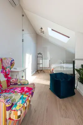 a living room with a couch and a bed at Tomasza Residence in Kraków