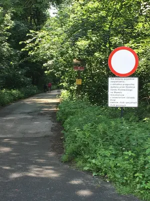 a road with a sign on the side of it at Nasza Polana Pokoje Noclegi Pieskowa Skała Ojców in Pieskowa Skała