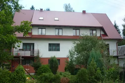 a white house with a red roof at Zawoja Pod Grapą in Zawoja