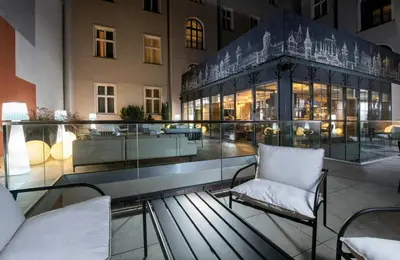 a building with a pool in the middle of it at Leonardo Boutique Hotel Krakow Old Town in Kraków