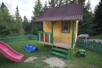 a room with stairs and a desk and a window at Gościniec pod Lubomirem in Węglówka
