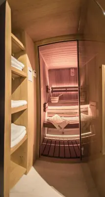 a walk in closet with a glass door at Stradom15 Apartments in Kraków