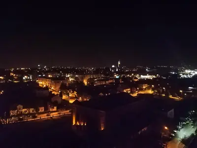 a view of a city at night with lights at Sky Apartments - Łagiewniki in Kraków