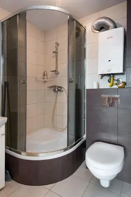 a bathroom with a shower and a toilet at Studio Aleja Pokoju II in Kraków