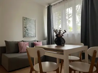 a living room with a table and a couch at Old Town Residence Bis in Kraków