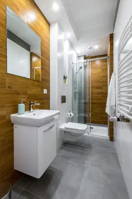 a bathroom with a sink and a toilet and a shower at Arianska Residence in Kraków