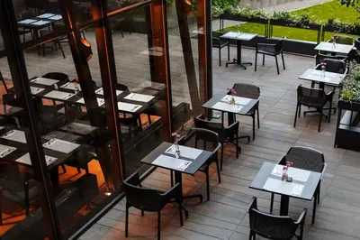 an overhead view of a restaurant with tables and chairs at Lwowska 1 in Kraków