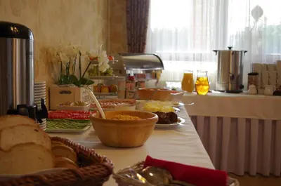 a kitchen with a buffet with food on a counter at Dworek Emilli in Wieliczka