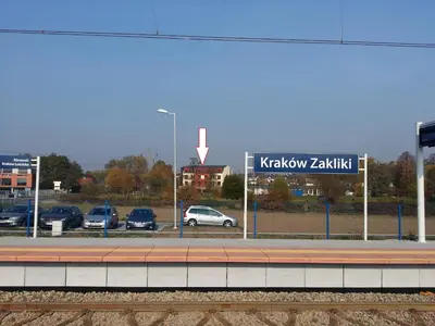 a parking lot with cars parked in a parking lot at Hotel Zakliki in Kraków
