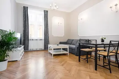 a living room with a couch and a table at Zwierzyniecka Old Town Apartments by Otium in Kraków