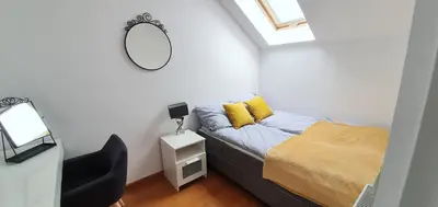 a small bedroom with a bed and a mirror at Old Town, Apartment, Blich in Kraków