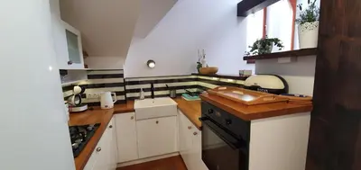 a small kitchen with white cabinets and a sink at Old Town, Apartment, Blich in Kraków
