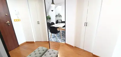 a mirror in a room with a chair and a desk at Old Town, Apartment, Blich in Kraków