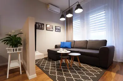 a living room with a couch and a table at Gertrudy Old Town Apartments in Kraków