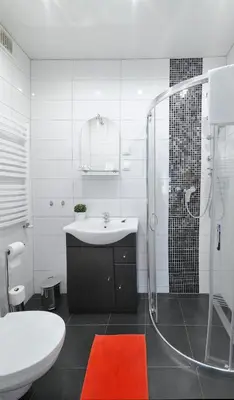 a white bathroom with a sink and a shower at 7th Room Guest House in Oświęcim