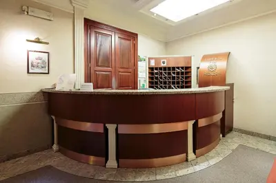 a bar in a hotel room with a wine cellar at Calliope Apartments in Kraków