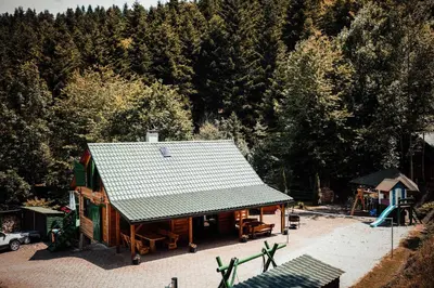 an overhead view of a house with a roof at Świerkowe Zacisze Domki in Budzów