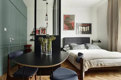 a bedroom with a table and a bed at FOUR STORIES APARTMENTS - Krasinskiego in Kraków