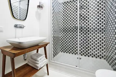 a bathroom with a sink and a shower at FOUR STORIES APARTMENTS - Krasinskiego in Kraków