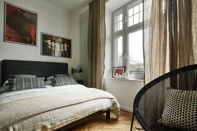 a bedroom with a bed and a window at FOUR STORIES APARTMENTS - Krasinskiego in Kraków
