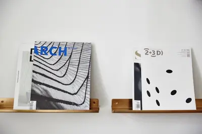 a nintendo wii and a book sitting on a shelf at FOUR STORIES APARTMENTS - Krasinskiego in Kraków