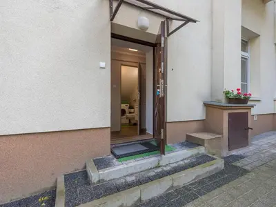 an entrance to a building with a door and stairs at Centre Apartments-Old Town in Kraków