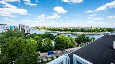 a view of a river from a building at A11 Apartments & SPA Dermique in Kraków