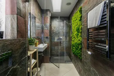 a bathroom with a shower and a sink at A11 Apartments & SPA Dermique in Kraków