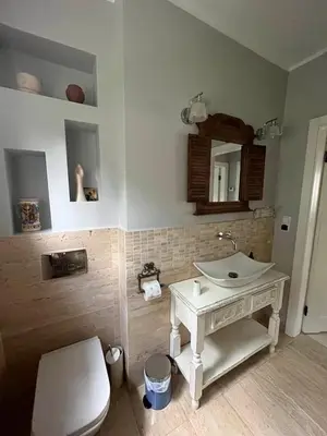a bathroom with a white sink and a toilet at Leśna 6 - House with a garden in Bolechowice