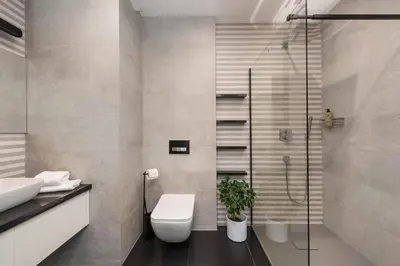 a bathroom with a shower and a toilet and a sink at Old Town Luxury Apartments in Kraków