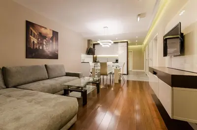 a living room with a couch and a table at Old Town Luxury Apartments in Kraków