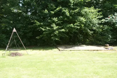 a triangle in the middle of a grass field at Dworek Młynarza in Zator