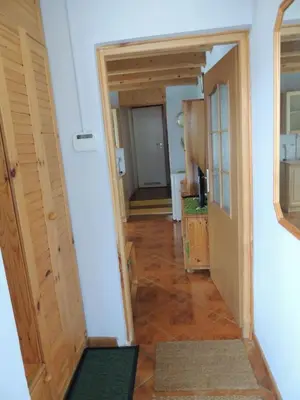 a hallway with a hallway leading into a room at Apartament Suzyw Kicek in Sucha Beskidzka
