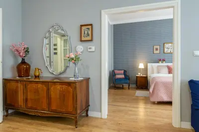 a kitchen and dining room with a table and chairs at Smile Apartments Center Kraków Old Town in Kraków