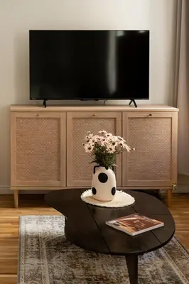 a kitchen with a washing machine and a picture on the wall at Prestigious Main Square Apartment in Kraków