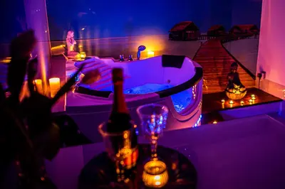 a group of people in a bathtub in a room at Jacuzzi Apartment Zen in Kraków