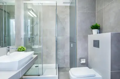 a bathroom with a sink and a toilet and a shower at Cracow Rentals Zacisze in Kraków