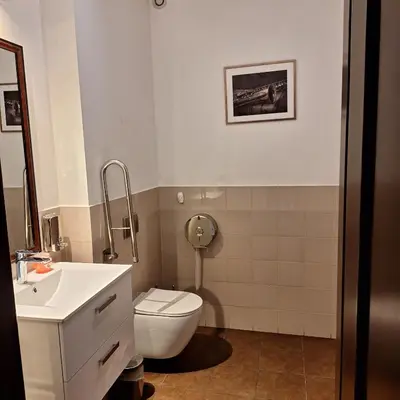 a bathroom with a toilet and a sink at Eko Dom Eturia in Suchoraba