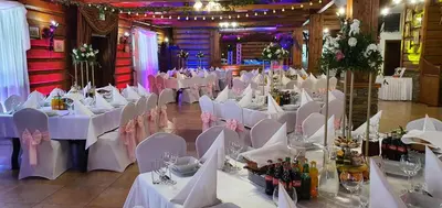 a banquet hall with white tables and chairs at Hotel Zajazd Celtycki in Zakrzów