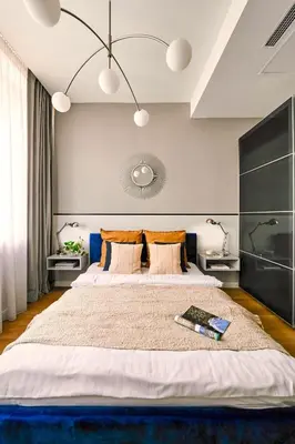 a large bedroom with a large bed with a large headboard at Wielopole17 Max Apartment with AC in Kraków