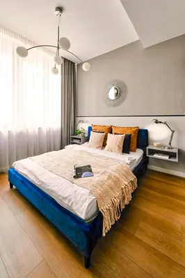 a bedroom with a large bed in a room at Wielopole17 Max Apartment with AC in Kraków