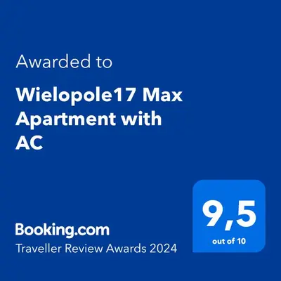 a blue screen with the text awarded to website max appointment with ac at Wielopole17 Max Apartment with AC in Kraków
