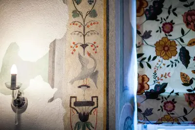 a wall with a painting of a bird on it at Royal Residence by OTR in Kraków