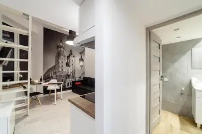 a kitchen and living room with a dining room at 2 Nights Apartments - great location, right next to Main Rail and Bus Station, 10 min to Main Square by foot in Kraków