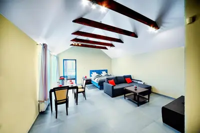 a living room with a couch and a table at Apartamenty Salt Delux in Wieliczka